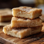 Deliciously baked Cinnamon Sugar Blondies topped with a cinnamon sugar blend