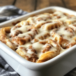 Delicious quick overnight cinnamon roll casserole topped with icing
