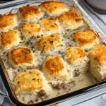 Biscuits and Gravy Breakfast Casserole 7 Biscuits and Gravy Breakfast Casserole ready to serve on a plate