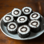 Plate of delicious Oreo Sushi Rolls with creamy filling and chocolate topping
